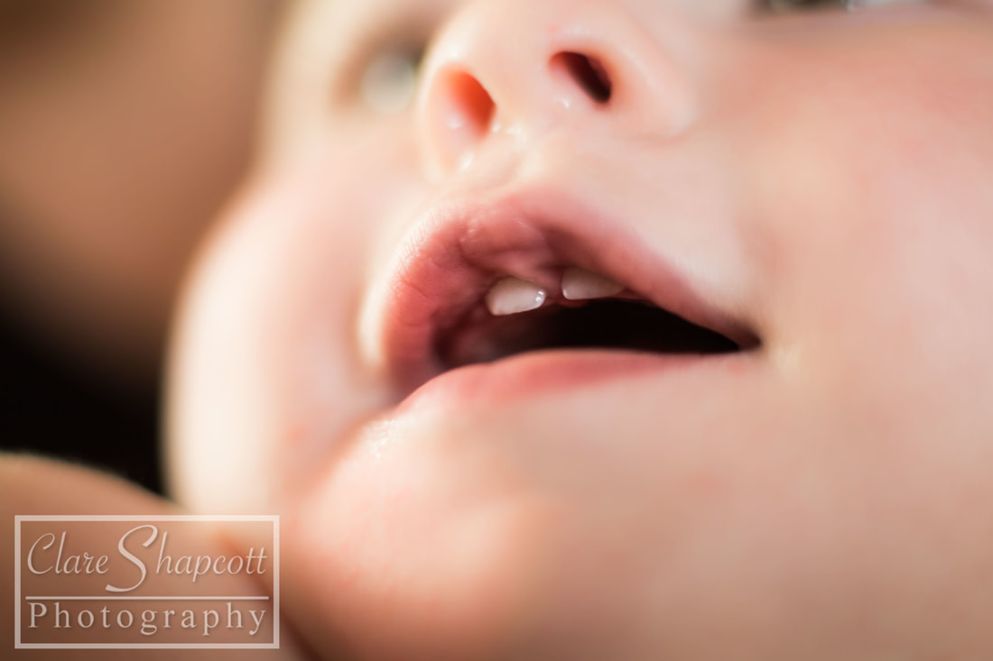 Close up of baby's teeth coming through at my photography studio in Bristol.