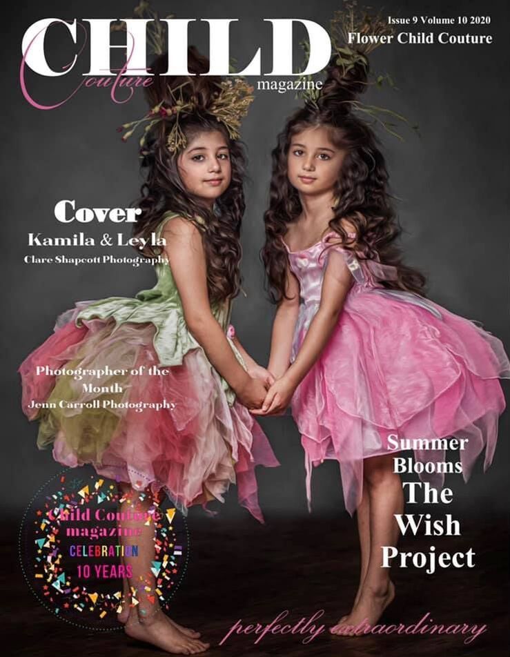Cover of child couture magazine showing a fine art photograph by Clare Shapcott of two girls in pink dresses holding hands.