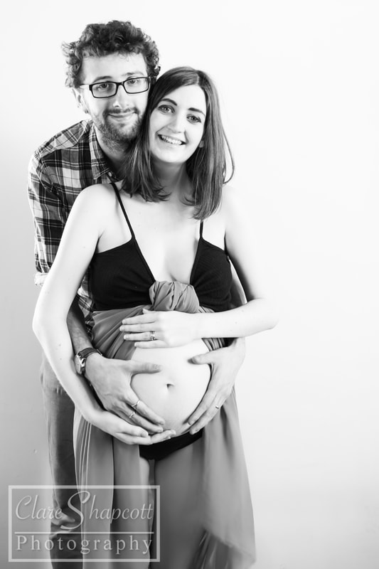 Black and white photograph while pregnant with partner