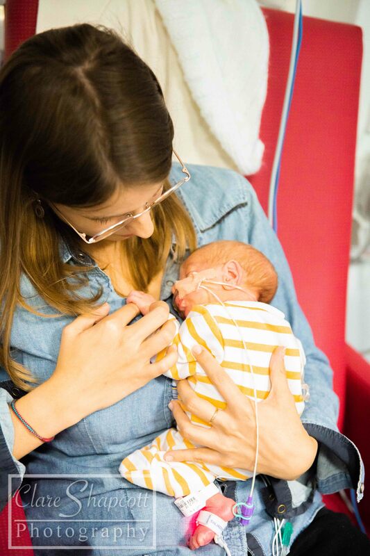 Picture of mum with glasses and NICU baby
