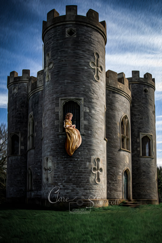 Young girl in royal yellow dress sits at tower window with dress danging off the side.