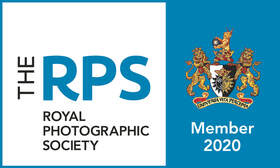 The Royal photographic society blue and white logo.