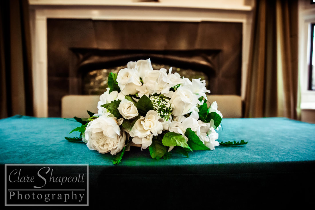 Image of beautiful white wedding flowers on blue table