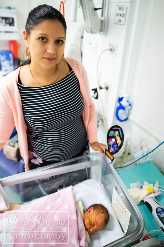 Image of mum and baby in NICU with stripes