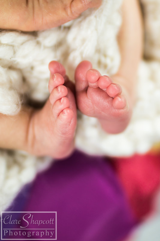 Cute detailed feet of newborn rainbow child